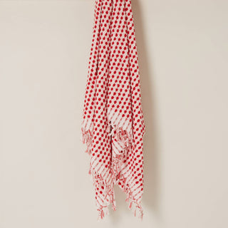 Red, white and pink towel on a beige background. 