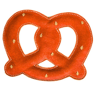 Giant Pretzel Dog Toy pictured. Red pretzel-shaped dog toy with white stitching and small fabric buttons that resemble pretzel salt. Pictured on a white background.