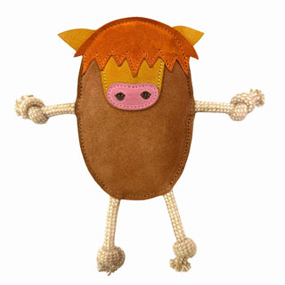 Brown plush toy resembling a Highland Cow. He has yellow ears, a pink nose and red hair. He is pictured on a white background.