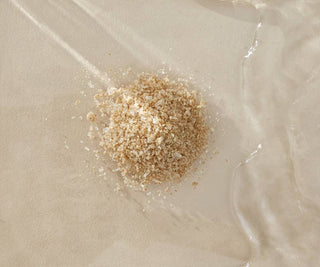 Small pile of bath salts undissolved in a bath of water. 